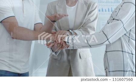 Business people joining hands together, demonstrating their strong teamwork and collaboration in achieving shared goals. Business people concept Business people joining hands together, demonstrating their strong teamwork and collaboration in achieving shared goals. Business people concept 131607560