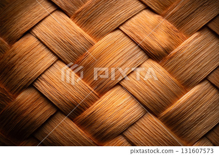 Close up of brown woven basket texture pattern, showcasing intricate interlacing and natural material. warm tones and detailed craftsmanship evoke sense of rustic charm 131607573