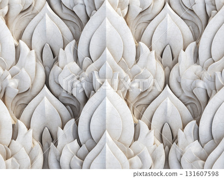 Intricate white leaf pattern wall carving with symmetrical design, showcasing detailed craftsmanship and artistic elegance. texture and depth create captivating visual effect 131607598