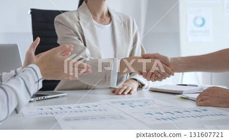 Professional business team clapping hands, celebrating successful presentation, displaying collaborative spirit and workplace enthusiasm in modern office setting Professional business team clapping hands, celebrating successful presentation, displaying collaborative spirit and workplace enthusiasm in modern office setting 131607721