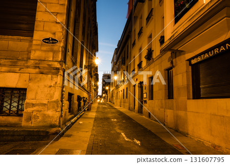 The old town of San Sebastian, Spain, before dawn: deserted cobblestone streets, streetlights and historic buildings The old town of San Sebastian, Spain, before dawn: deserted cobblestone streets, streetlights and historic buildings 131607795