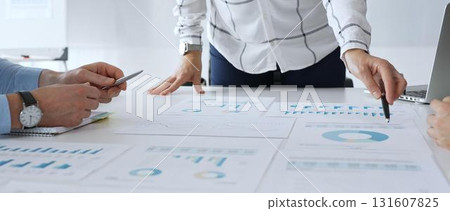 Business team analyzing financial charts during strategy meeting, professionals discussing data and performance metrics at workplace for decision making success Business team analyzing financial charts during strategy meeting, professionals discussing data and performance metrics at workplace for decision making success 131607825