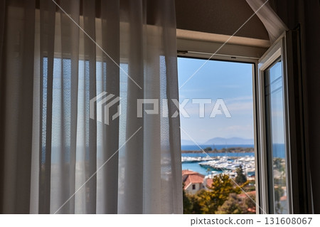 Apartment with sea view, open balcony door 131608067