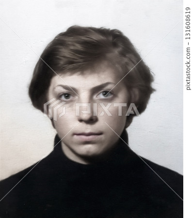 Vintage portrait of a young, serious-looking, fair-haired woman. Retro photo, 1975. 131608619