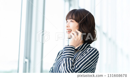 Woman/businesswoman talking on smartphone Woman/businesswoman talking on smartphone 131608678
