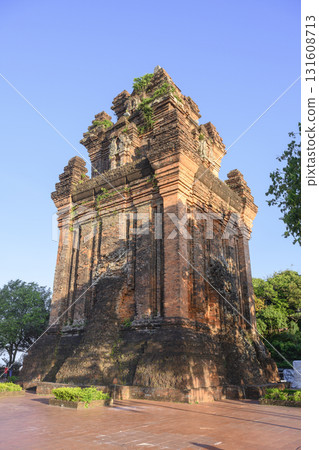 Ancient sacred Cham Tower of 12 century overgrown with grass and small trees in Tuy Hoa, Vietnam 131608713