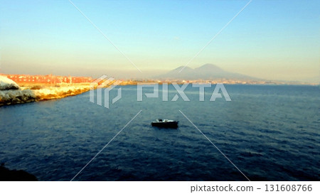 The Gulf of Naples at sunset with a boat in the middle of the sea and Vesuvius in the background. 131608766