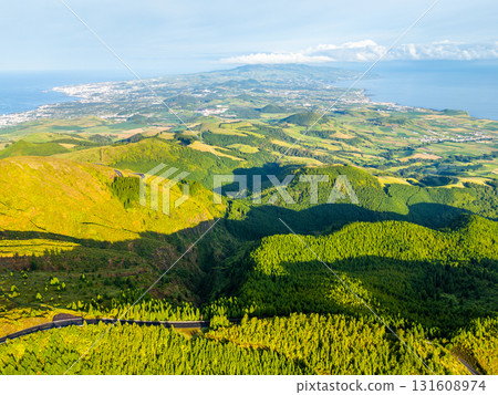Green Hills and Forest in Morning. Atlantic Ocean. Azores, Sao Miguel Island, Portugal. Aerial View Green Hills and Forest in Morning. Atlantic Ocean. Azores, Sao Miguel Island, Portugal. Aerial View 131608974