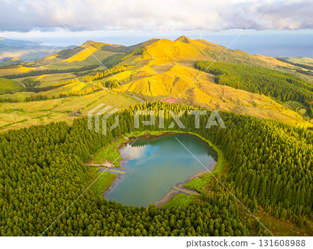 Hills, Forest and Lake Lagoa do Canario at Sunset. Azores, Sao Miguel Island, Portugal. Aerial View 131608988