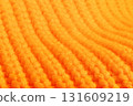 The orange fabric has a striped pattern 131609219