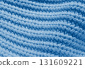 A blue knit sweater with a blue background 131609221