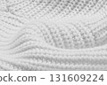 A white knit sweater with a pattern of white yarn 131609224