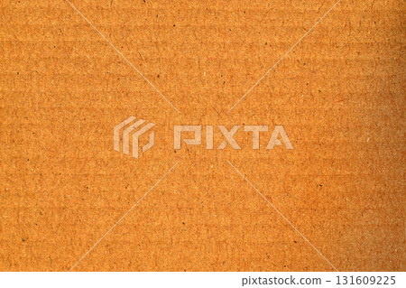 A brown cardboard background with a white dot in the middle 131609225