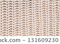 A close up of a knitted fabric with a white background 131609230