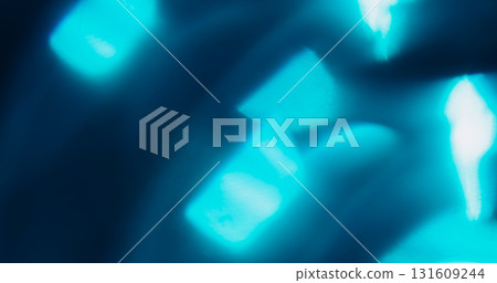 Glow leak. Defocused glow texture. Vibrant blue color gleam optical lens flare shiny flash on abstract luminous visual art background. 131609244