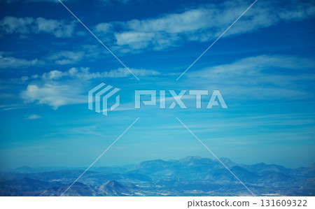 Stunning Mountain Range Under Clear Blue Sky With Far Horizon - Tranquil Landscape Stunning Mountain Range Under Clear Blue Sky With Far Horizon - Tranquil Landscape 131609322