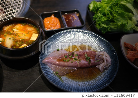 Seafood vegetables sauce. blue plate with seafood 131609417