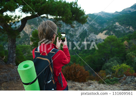 Hiker With Backpack Photos Scenic Mountain Forest View While Standing on a Trail Hiker With Backpack Photos Scenic Mountain Forest View While Standing on a Trail 131609561