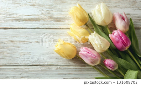 tulips on a rustic white wooden background 131609702