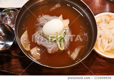 Korean cold noodles in chilled broth 131609930