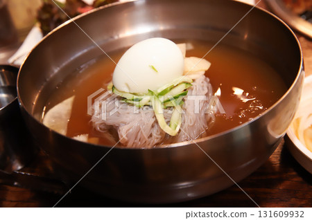 Korean cold noodles in chilled broth 131609932