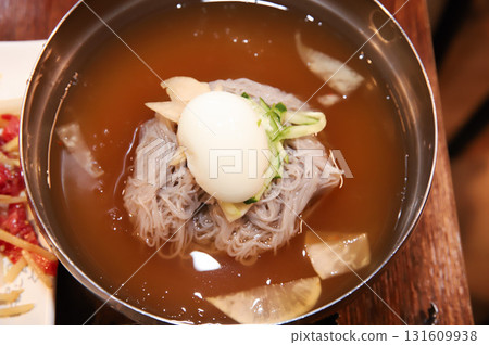 Korean cold noodles in chilled broth Korean cold noodles in chilled broth 131609938