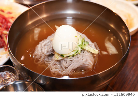 Korean cold noodles in chilled broth 131609940