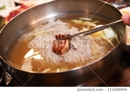 Korean cold noodles in chilled broth Korean cold noodles in chilled broth 131609944