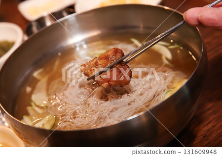 Korean cold noodles in chilled broth 131609948