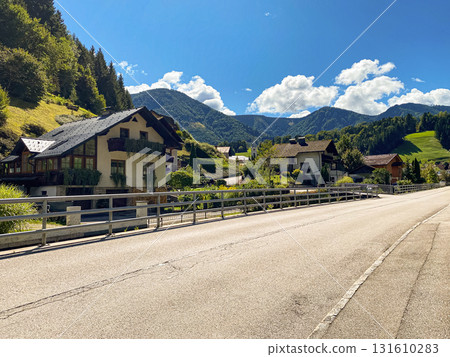 Traditional European Village with Charming Houses in Mountain Nature 131610283