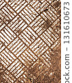 Geometric white pattern on ground texture. Abstract white geometric pattern on earthy textured ground with lines and symmetry. Background for design or texture use. 131610673