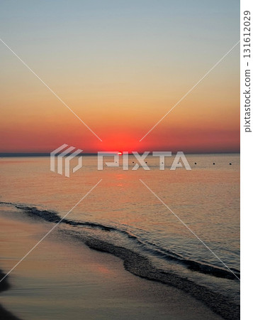 Beach Sunset with Gentle Wave Trail 131612029