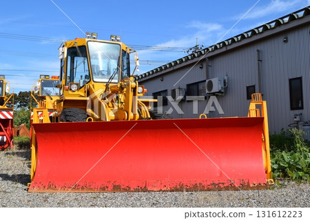 Snowplow waiting in a snowy country 131612223