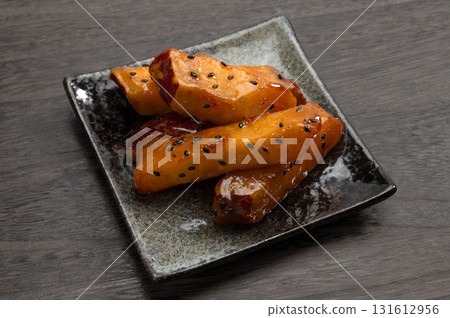 Sweet potato sticks cut into pieces Sweet potato sticks cut into pieces 131612956