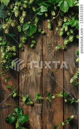Closeup of fresh green hop cones and leaves on an aged wooden table,  for beer branding and product designs. 131613265