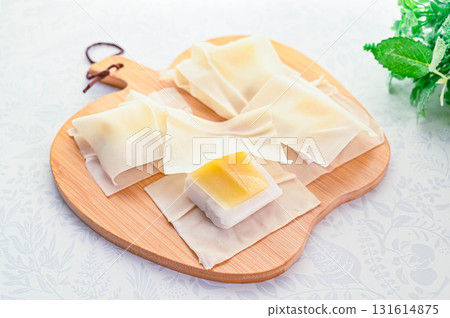 Sandwich the fish cake and cheese between the skins 131614875