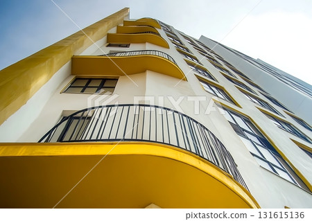 Modern Architectural Building with Curved Balconies and Clear Sky in Urban Environment 131615136