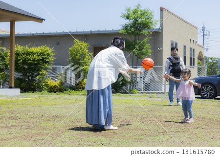 Family playing in the garden Family playing in the garden 131615780
