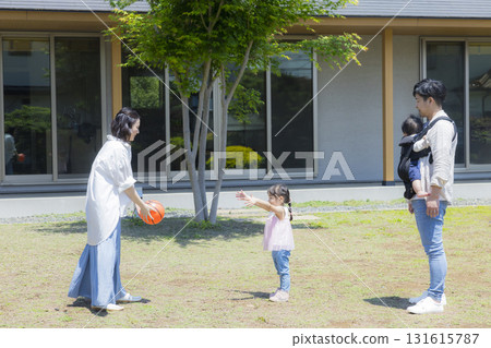 Family playing in the garden 131615787