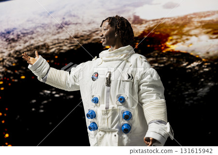 Astronaut preparing to land on outer space celestial body to analyze Mars planetary data. Cosmonaut in high tech suit exploring deep space with starship, doing Martian surface research 131615942