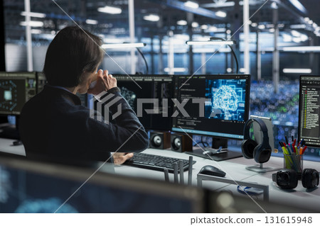 Technician in data center drinking coffee and optimizing hardware for AI tasks. Server hub employee enjoying caffeinated beverage at work, automating system diagnostics using deep learning Technician in data center drinking coffee and optimizing hardware for AI tasks. Server hub employee enjoying caffeinated beverage at work, automating system diagnostics using deep learning 131615948