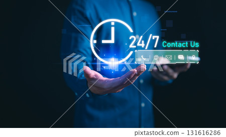 Businessman holding digital 24/7 contact support icons with phone, email, chat, customer service, online map and communication solution. Concept of business support and client assistance anytime. 131616286
