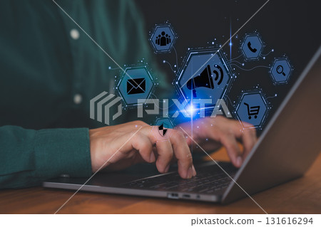 Man using laptop with digital marketing icon, online advertising, email marketing, e-commerce and business communication. Concept of social media promotion, customer engagement and digital strategy. 131616294