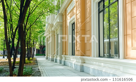 Sunlight Glimmers on Modern Building Facade with Large Windows and Natural Stone Textures 131616506