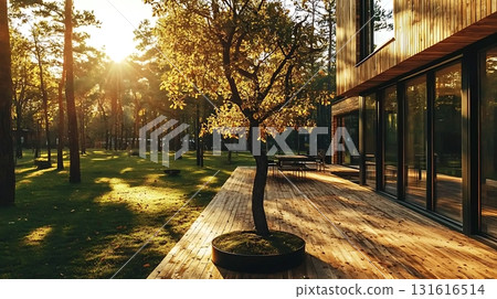 Sunlight Glimmers on Modern Building Facade with Large Windows and Natural Stone Textures 131616514