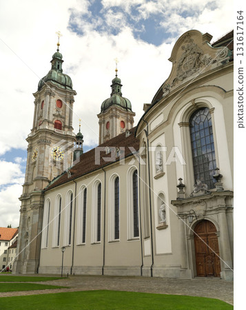 Stunning historic church with tall towers under a cloudy sky in a serene setting Stunning historic church with tall towers under a cloudy sky in a serene setting 131617164