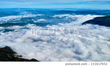 Breathtaking view over a sea of clouds from a high mountain landscape in the morning light showcasing the beauty of nature 131617652