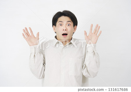 Man in his 20s, surprised, white background 131617686