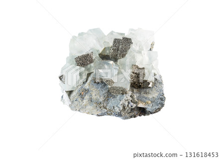 Natural fluorite mineral with cubic crystal structure and pyrite specks, a geological specimen photographed on a bright white background. Natural fluorite mineral with cubic crystal structure and pyrite specks, a geological specimen photographed on a bright white background. 131618453