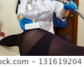 LPG massage procedure for removing subcutaneous fat from a young woman. 131619204